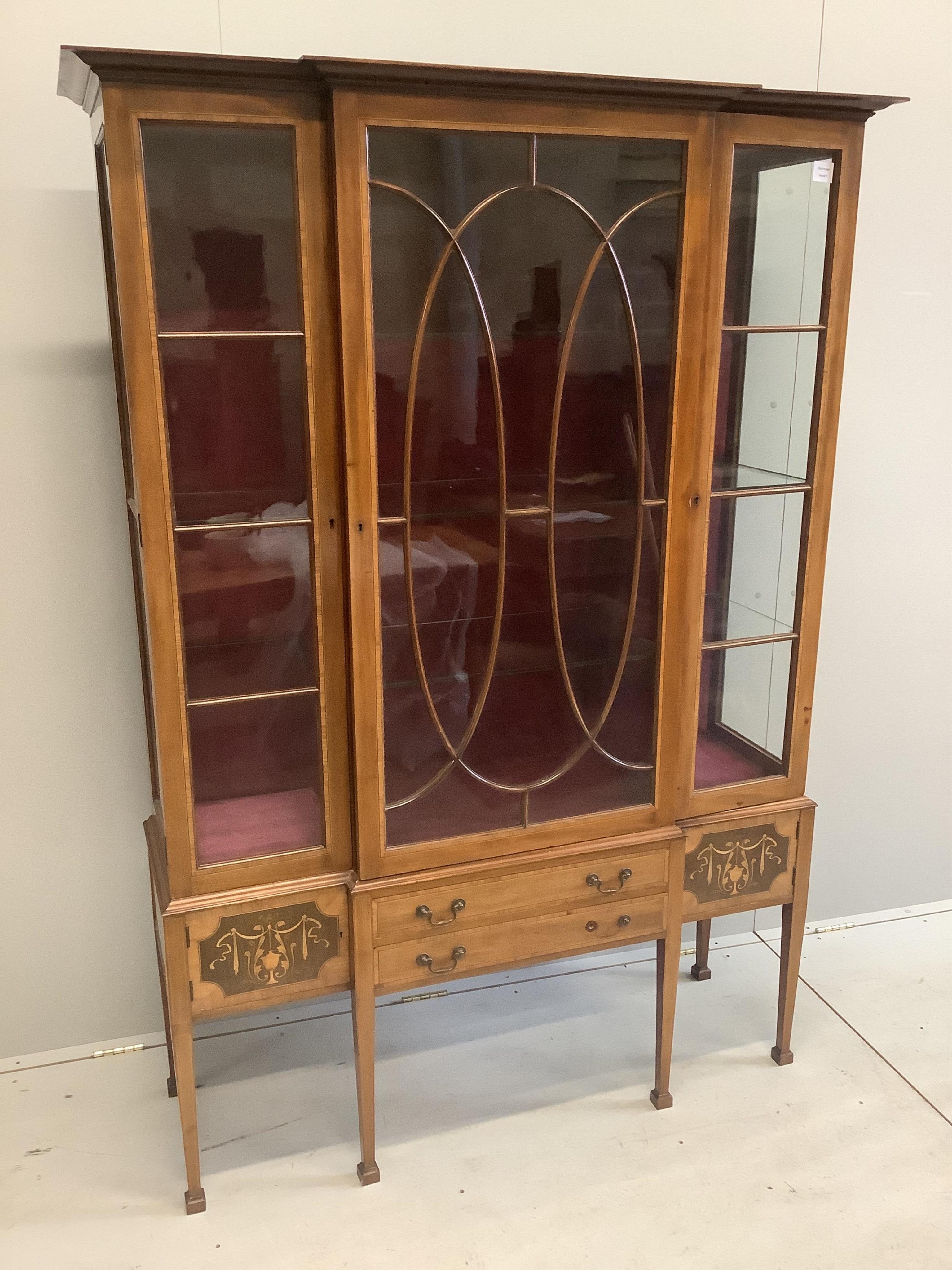 An Edwardian marquetry inlaid satinwood banded mahogany breakfront display cabinet, width 132cm, depth 42cm, height 186cm. Condition - fair